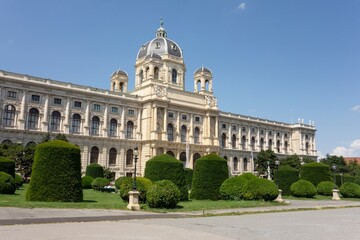 Garden and lampposts at Maria Theresien Platz town square with building of Naturhistorisches Museum Wien
