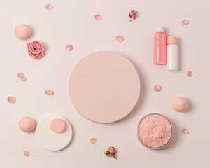 Aromatic crystals of sea salt with essential oil flower of rose. Spa composition with cosmetic bathroom product top view