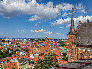 An aerial shot of the Hanseatic City of Wismar with red roofs of historic buildings