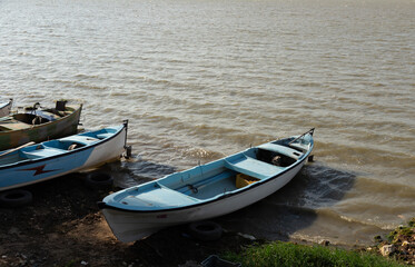Fototapeta na wymiar fishing boats by the lake