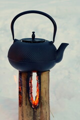 teapot on the fire Swedish torch, food in cauldron, campfire food, kettle on the fire - obrazy, fototapety, plakaty