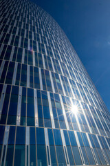 Liege, Belgium, sunny summer afternoon street view. Sun light reflection diffraction effect