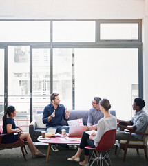 Its a creative space. Shot of a group of coworkers in a meeting in an office.