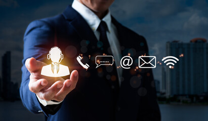 A guy grasps an operator's emblem, which includes symbols for after-sales services. Customer satisfaction communication channel