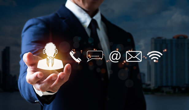 A guy grasps an operator's emblem, which includes symbols for after-sales services. Customer satisfaction communication channel