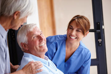 Receiving the best care available. Cropped shot of a female nurse standing by her senior patient and his wife.