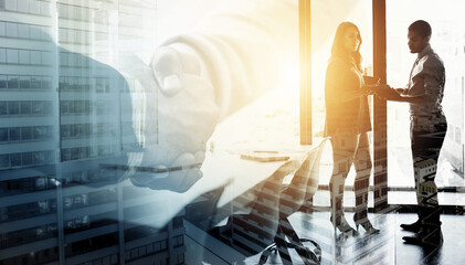 Coming up with a plan of action. Digitally enhanced shot of two businesspeople talking in their office.