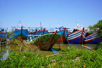 A wooden fishing boat is parked at the mouth or riverside of the Juwana River, Pati regency,...