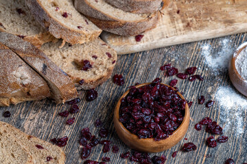fresh cut bread made of flour and dried cranberries