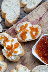 natural red salmon caviar with baguette and butter