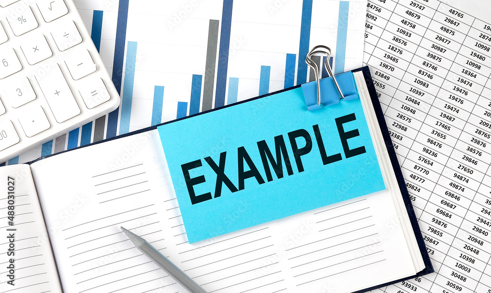 Poster example text on blue sticker on the chart background near calculator