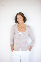 The most important thing a girl wears is confidence. A mature woman posing confidently while...
