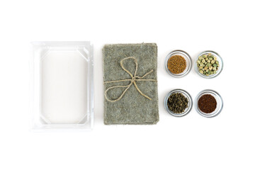 Gardening set isolated on white background, mustard, radish, pea and beetroot seeds, coconut coir and containers for growing microgreens. Top view