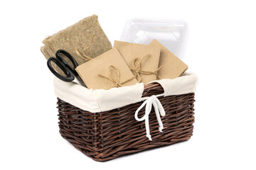 Obraz premium Gardening basket, seeds in paper bags, coconut coir and containers for growing microgreens at home. Side view