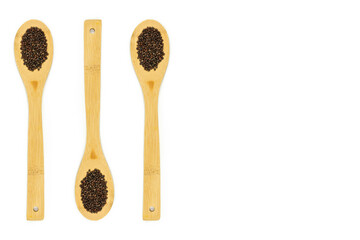 Wooden spoons with microgreen seeds. Growing greens at home, vegan and healthy food concept. Copy space
