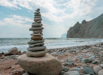 Fototapeta na wymiar Pyramid of pebbles on the shore of the Black Sea