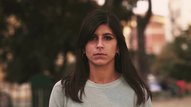 Serious girl looks into the camera