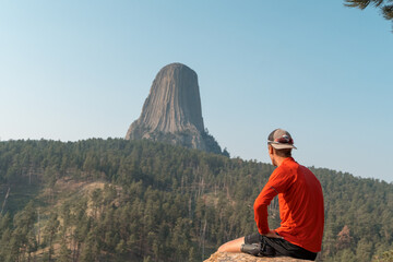 person looking at mountains in the distance 