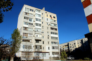 Nine-story brick house, multi-apartment in a residential area of ​​the city of Ukraine, built during the USSR. Eastern European architecture