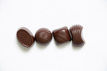 chocolate candies on a white background close up