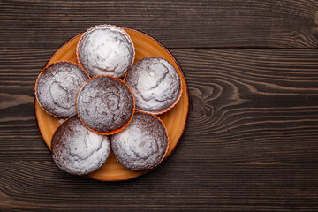 Obraz na płótnie Canvas chocolate cupcakes on a plate top view