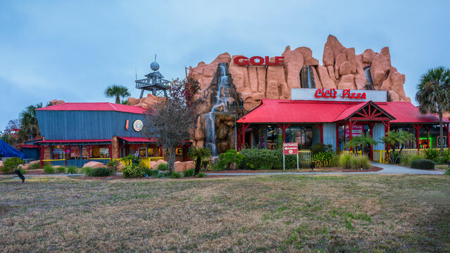 Kissimmee, Florida - February 6, 2022: Wide Panoramic View of Cicis Pizza Restaurant Building Exterior with Flowing Waterfalls in Orlando, FL. Cici' Pizza is a Family-friendly Retail Restaurant Chain.