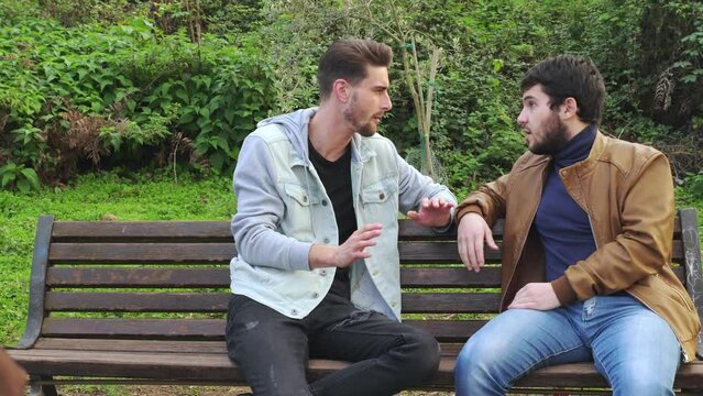 feel excluded - young man is excluded from the conversation by two friends
