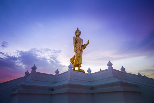 Buddha image or Buddha statue; Standing Buddha image with sunlight ray at Nong Pai Lom temple. 