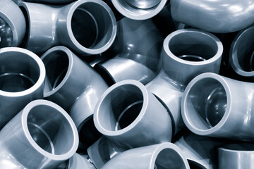 Grey pvc plumbing pipes corners background closeup - obrazy, fototapety, plakaty
