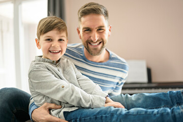 Father or godfather having fun on the living room At Home