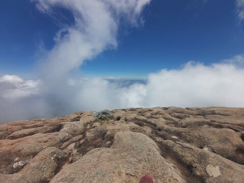 Over the sky we can see clouds and relax under the blue sky