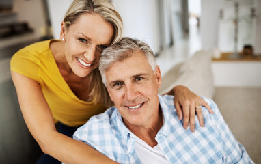 The only secret to a long marriage is love. Cropped shot of a loving mature couple relaxing at home.