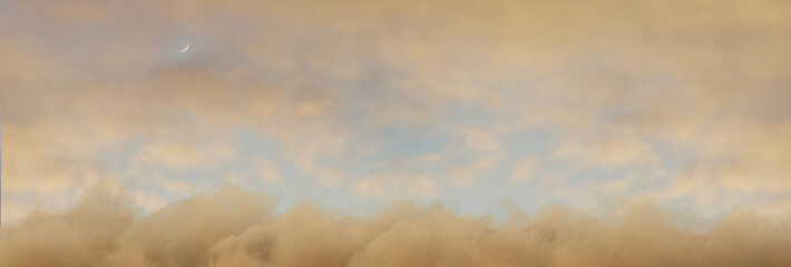 panoramic view to soft yellow sky with fluffy clouds and crescent moon