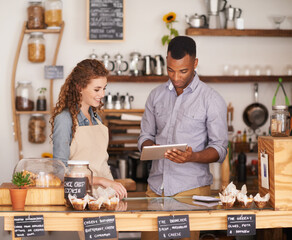 The coolest cafe in town. Shot of two people in a cafe.