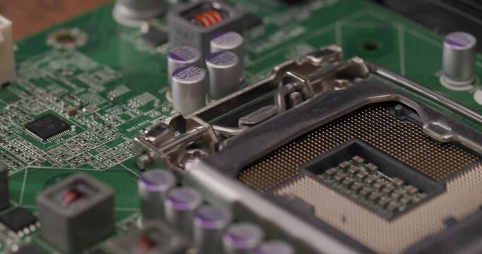 Computer motherboard. CPU socket. Memory dimm. PCI ports. External ports. Macro shots. 4k 23.976