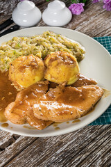 Stewed turkey meat in gravy.