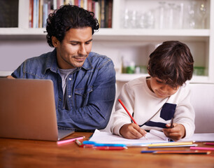 Hes such a clever kid. Shot of a father helping his son with his homework.