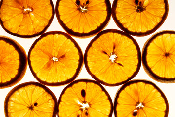 orange slices, orange detail on white backlit background, close up view