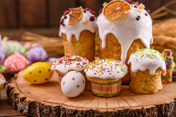 Festive cakes with white glaze, nuts and raisins on the festive table