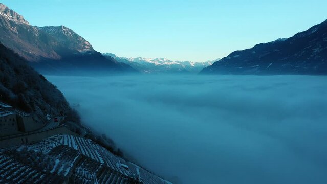 2022 - Excellent aerial view of a cloud blanket stretching from Martigny to Chamonix, Switzerland.
