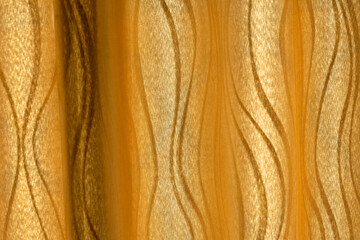 Golden background, silk, velvet, luxury, curtains, close-up There are streaks on the skin.