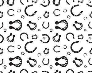 Black silhouettes of horseshoe on a white background, seamless illustration	
