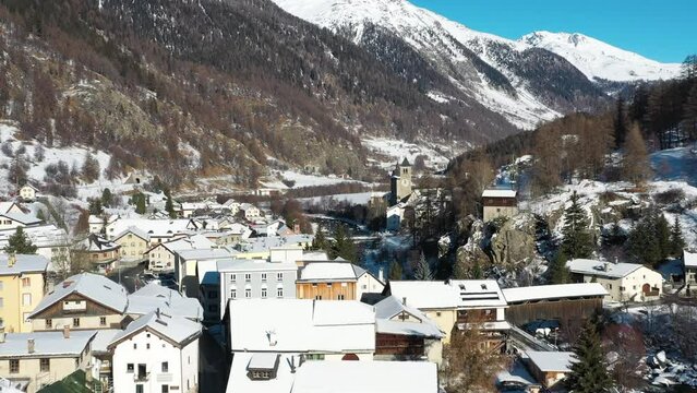 2022 - Excellent aerial view of the wintry town of Susch, Switzerland.