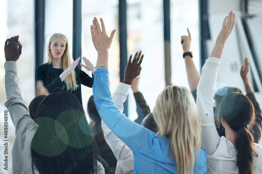 Poster never stop learning, because life never stops teaching. shot of a group of people raising their hand