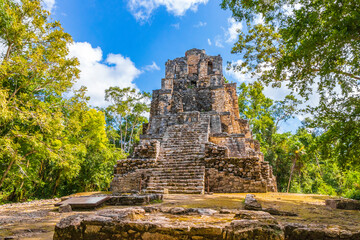 Ancient Mayan site with temple ruins pyramids artifacts Muyil Mexico.