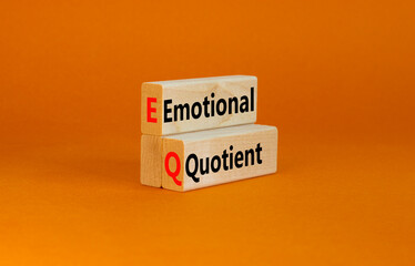 EQ emotional quotient symbol. Concept words EQ emotional quotient on wooden blocks on a beautiful...
