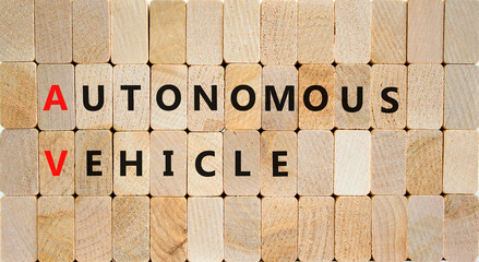 AV autonomous vehicle symbol. Concept words AV autonomous vehicle on wooden blocks on a beautiful wooden background. Business technology AV autonomous vehicle concept. Copy space.
