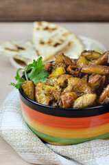 Typical and traditional food from Colombia and Mexico. Chunchurria with arepa,corn tortilla, accompanied by lemon and onion. Colorful plate. Beef casings. Colorful plate on wooden background. Close up