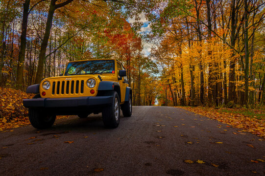 MERCER, PENNSYLVANIA - NOVEMBER 3, 2017: A Jeep Wrangler blending in with the fall foliage.