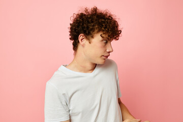 guy with red curly hair in white t-shirt casual wear emotions isolated background unaltered